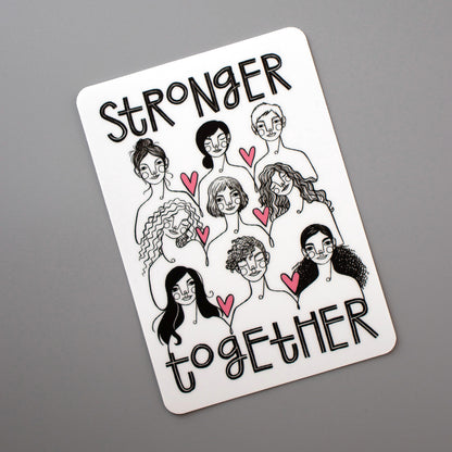 Stronger Together vinyl sticker from Make Lovely Things. Illustration by Kim Bonner features nine women with the words, "Stronger Together".