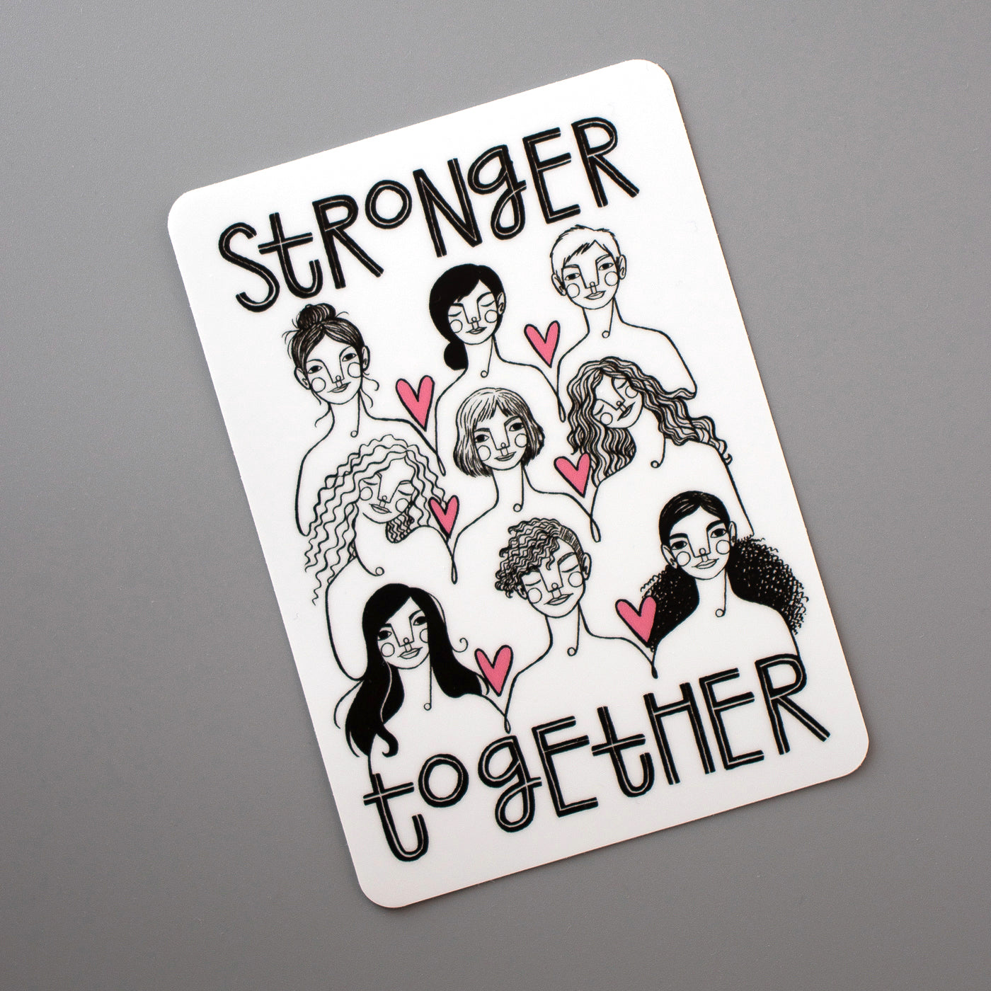 Stronger Together vinyl sticker from Make Lovely Things. Illustration by Kim Bonner features nine women with the words, "Stronger Together".